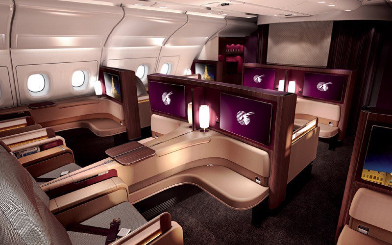 Business class suite with a lie-flat bed and privacy door